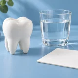 Tooth model, water and symptom notes for tooth sensitivity after a filling